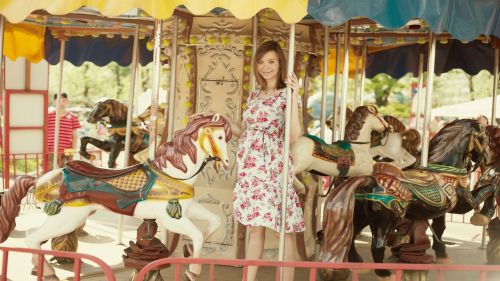 girl on carousel pregnant horse