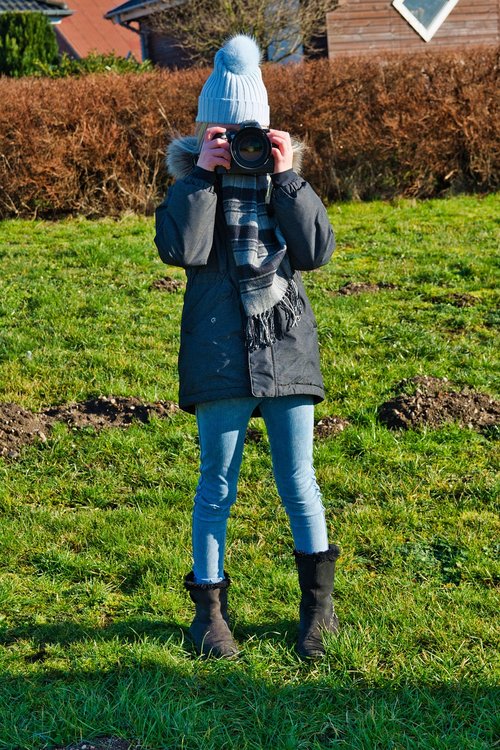 girl photographing  child  camera