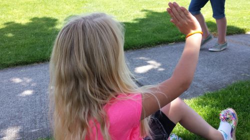 Girl Waves In A Park