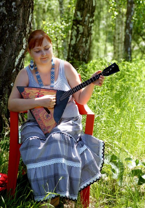 girl with balalaika musical instrument russian folk clothes