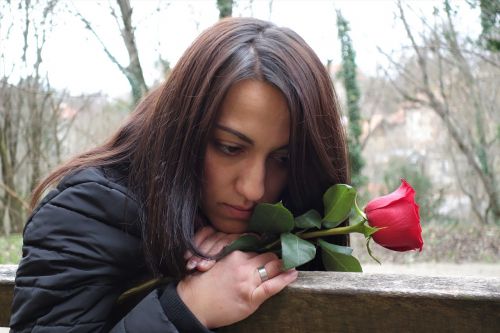 girl with red rose love waiting