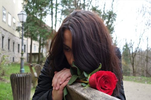 girl with red rose love waiting