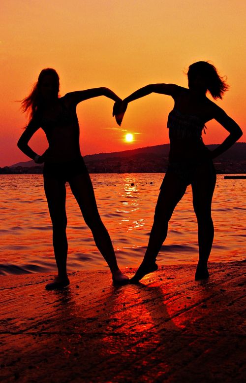 girlfriends silhouette sunset