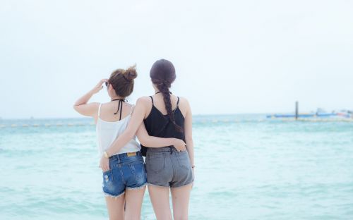 girls looking at the sea pattaya thailand