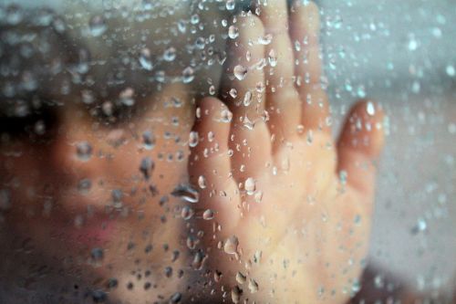 glass rainy window hand