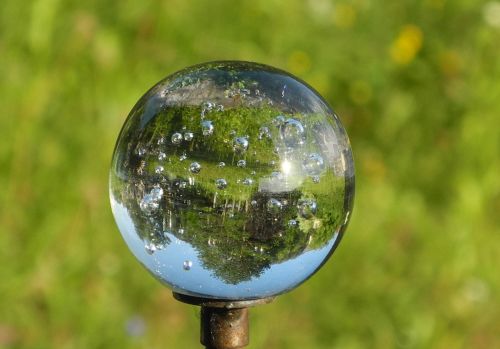 glass ball mirroring topsy-turvy world