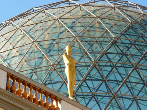 glass dome figure golden