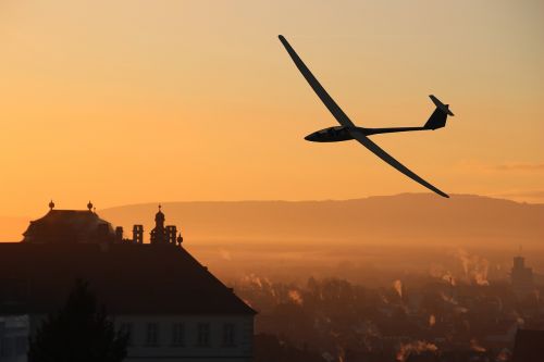 glider pilot city morning
