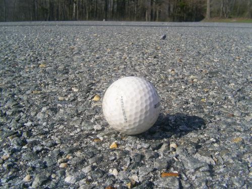golf ball road asphalt