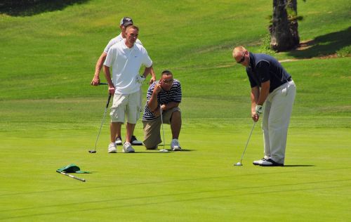 golfers golfing green