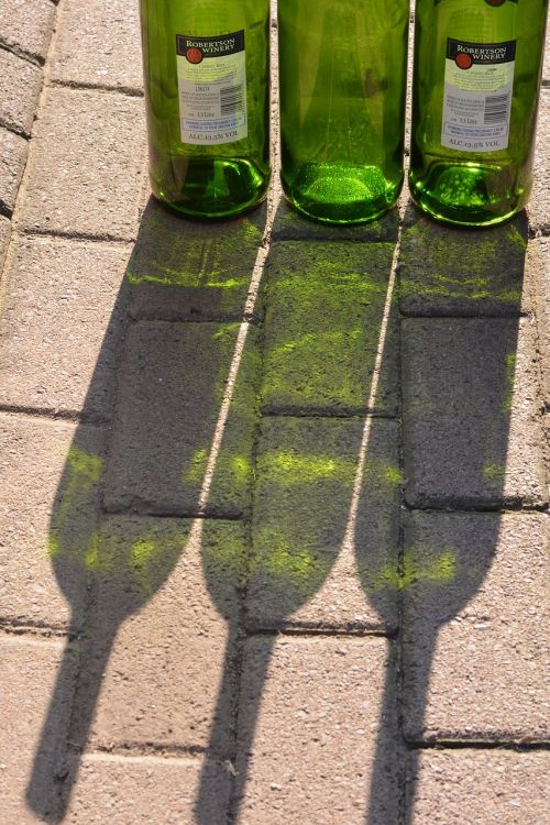 green shadow bottles glass
