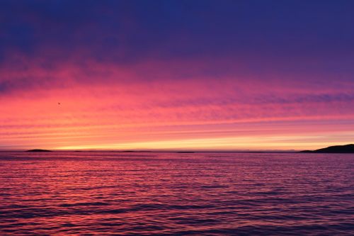 greenland sunset by the water