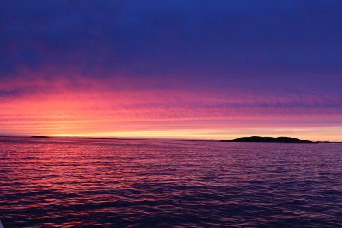 greenland sunset by the water