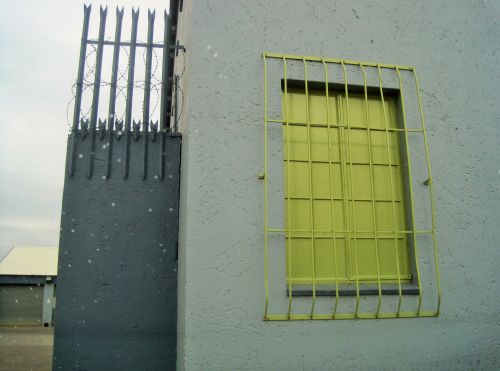 Grey Building With Yellow Window