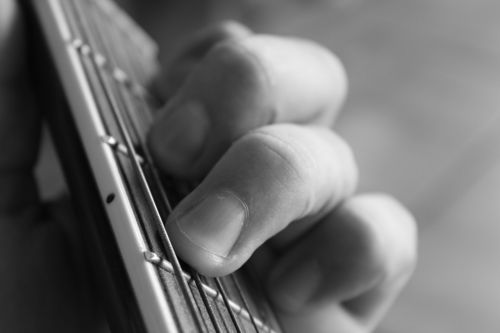 guitar black and white fingers