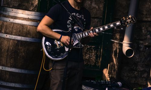 guitar player street busker
