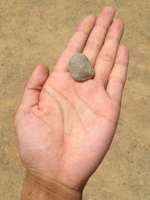 hand stone sand