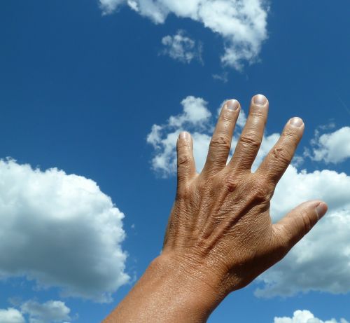 hand sky clouds