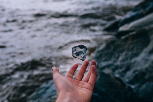 hand outdoors rock