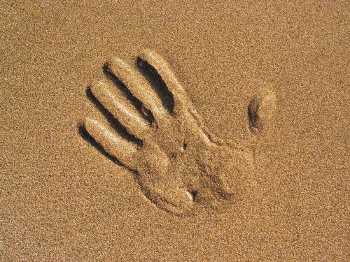 hand sand beach