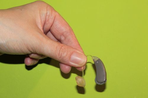 hand hearing aid deafness