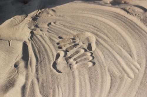 handprints beach sand