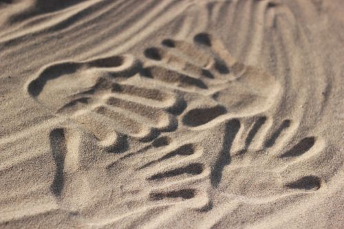 handprints beach sand