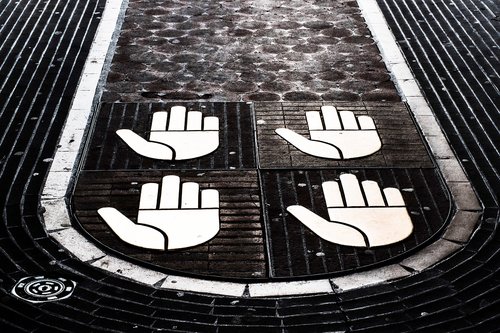 hands  symbolic  cobbled walkway