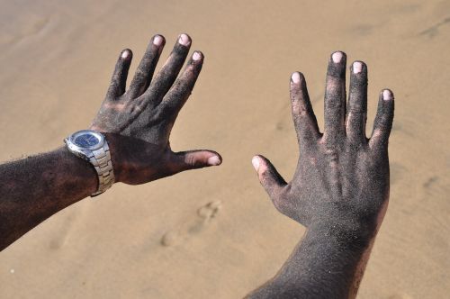 hands sand beach