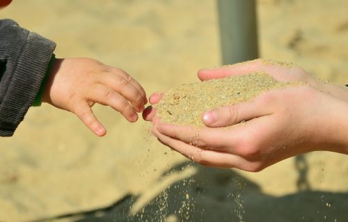 hands sand children's hands