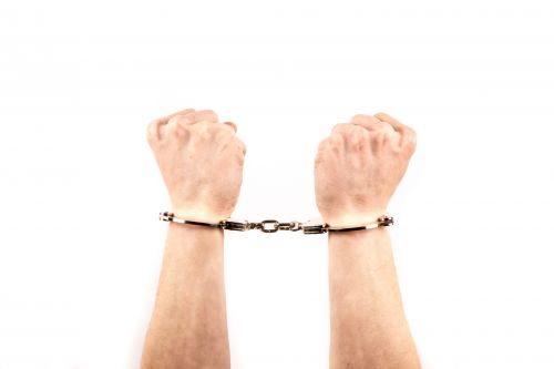 Hands In Handcuffs