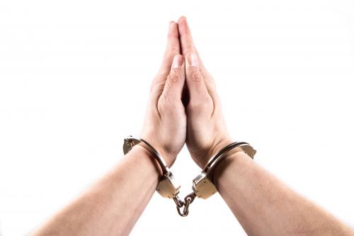 Hands In Handcuffs