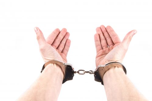 Hands In Handcuffs