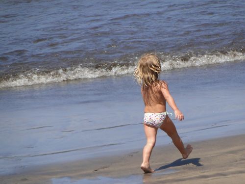 happy the little girl beach