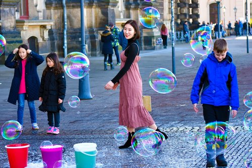 happy young  soap bubbles  tourism