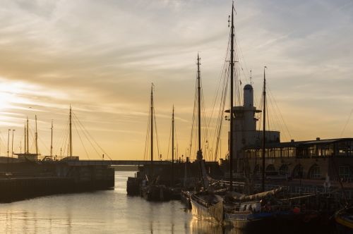harbor sunset sailboats