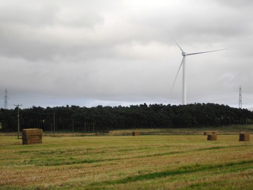 hay bales field wind turbine