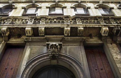 head sculpture venice door