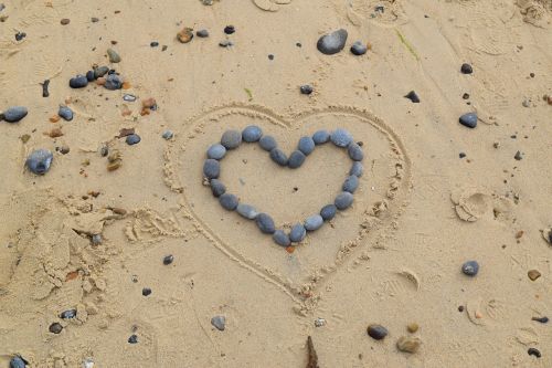 heart stones sand
