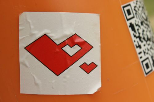 heart sticker on dustbin red white