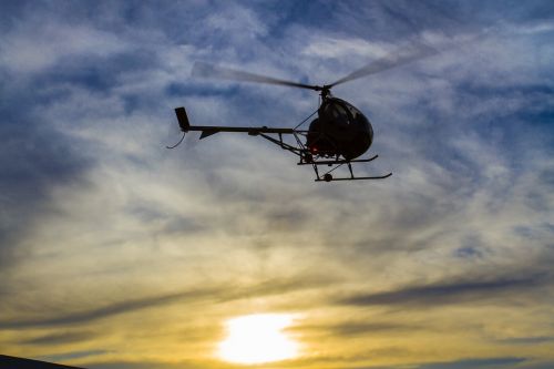 helicopter against light sky