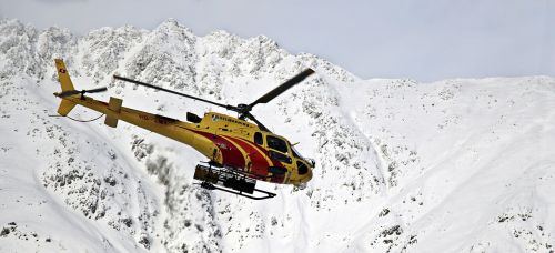helicopter mountains snow