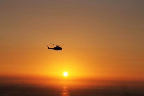 helicopter sun sunset