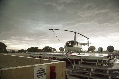 helicopter in rain stormy day on roof tv station helicopter in the rain