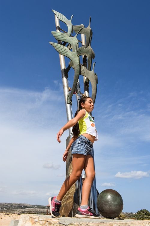 herons sculpture girl