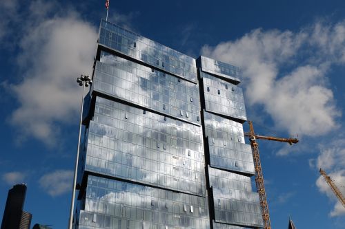 high rise buildings white cloud blue sky