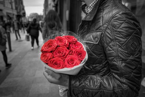 holding red roses romance