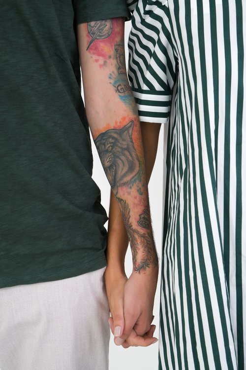 holding hands  tattoos  couple