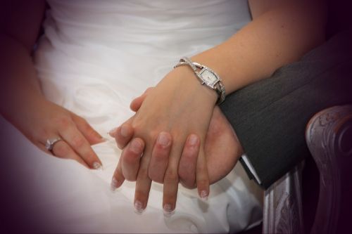holding hands wedding ring