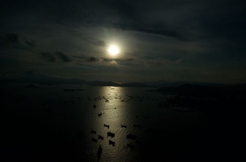 hong kong harbour boats sunset moody